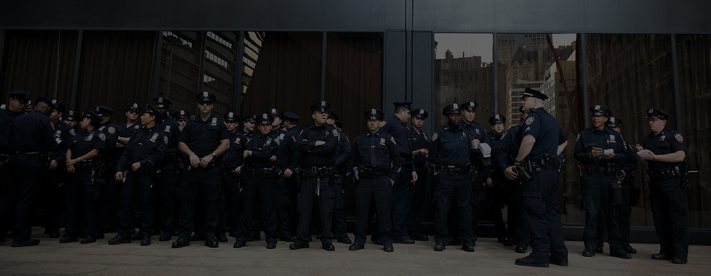 Police Officers standing in front of a building